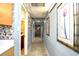 Hallway with tiled floor, artwork, and utility access at 2310 N Ocean Blvd. # 1107, Myrtle Beach, SC 29577