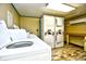 Bright laundry room featuring stacked washer and dryer units at 2310 N Ocean Blvd. # 1107, Myrtle Beach, SC 29577