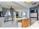 Living room and partial kitchen with island seating, and balcony access at 2310 N Ocean Blvd. # 1107, Myrtle Beach, SC 29577