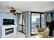 Living room area with fireplace and balcony access at 2310 N Ocean Blvd. # 1107, Myrtle Beach, SC 29577