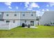 Backyard with patio, grill and view of sliding glass doors and white fence at 238 Christiana Ln. # C, Myrtle Beach, SC 29579
