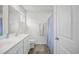 Bright bathroom with double sink vanity, wood-look floors, and white fixtures at 238 Christiana Ln. # C, Myrtle Beach, SC 29579