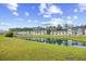 Lush community pond view surrounded by well-maintained townhomes at 238 Christiana Ln. # C, Myrtle Beach, SC 29579