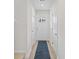 Bright entryway featuring white walls, wood-look floors, and a white door with a glass insert at 238 Christiana Ln. # C, Myrtle Beach, SC 29579