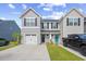 Charming townhome with gray siding, black shutters, white garage, and inviting black and blue front doors at 238 Christiana Ln. # C, Myrtle Beach, SC 29579