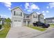 Charming townhome featuring gray siding, black shutters, a white garage door, and a blue front door at 238 Christiana Ln. # C, Myrtle Beach, SC 29579