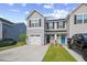 Charming townhome with gray siding, black shutters, white garage, and inviting black and blue front doors at 238 Christiana Ln. # C, Myrtle Beach, SC 29579