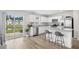 Modern kitchen featuring white cabinetry, granite countertops, stainless steel appliances, and a view to the water at 238 Christiana Ln. # C, Myrtle Beach, SC 29579