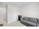 Comfortable living room featuring a gray sofa, a bookshelf, and neutral carpeting at 238 Christiana Ln. # C, Myrtle Beach, SC 29579