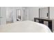 Spacious primary bedroom with modern furniture and adjoining bathroom at 238 Christiana Ln. # C, Myrtle Beach, SC 29579