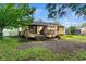 Backyard with a wooden deck and a grill surrounded by grass at 238 Stonebrook Dr., Myrtle Beach, SC 29588