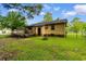 View of the back of the house and backyard with wood deck at 238 Stonebrook Dr., Myrtle Beach, SC 29588