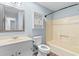 Well-lit bathroom featuring a bathtub, sink, toilet, and cabinet for storage at 238 Stonebrook Dr., Myrtle Beach, SC 29588