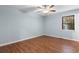 Spacious bedroom featuring hardwood floors, ceiling fan, and a window with natural light at 238 Stonebrook Dr., Myrtle Beach, SC 29588
