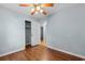 Bedroom with wood floors, ceiling fan, access to a closet and view into another bedroom at 238 Stonebrook Dr., Myrtle Beach, SC 29588