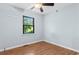 Bright bedroom featuring hardwood floors, a ceiling fan, and a window with blinds at 238 Stonebrook Dr., Myrtle Beach, SC 29588