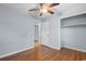 Bedroom with hardwood floors, closet, ceiling fan, and ample natural light at 238 Stonebrook Dr., Myrtle Beach, SC 29588