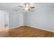 Bedroom with wood floors and ceiling fan with access to another room at 238 Stonebrook Dr., Myrtle Beach, SC 29588