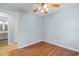 Bedroom with wood floors, ceiling fan and access to the bathroom at 238 Stonebrook Dr., Myrtle Beach, SC 29588
