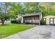 Charming single-story home with a screened porch and driveway offers great curb appeal at 238 Stonebrook Dr., Myrtle Beach, SC 29588