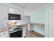 An open kitchen area with stainless steel oven, breakfast nook and view of the dining and living spaces at 238 Stonebrook Dr., Myrtle Beach, SC 29588