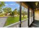 Screened-in porch with view of the front yard and street at 238 Stonebrook Dr., Myrtle Beach, SC 29588