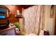 Close-up of a well decorated bathroom with wooden wall paneling and leaf-patterned shower curtain at 2419 Hilton Dr., North Myrtle Beach, SC 29582