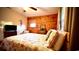Cozy bedroom with wood paneled walls, a comfortable bed, and a seahorse wall decoration at 2419 Hilton Dr., North Myrtle Beach, SC 29582