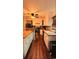 Bright kitchen with white cabinets, wood countertops, stainless steel appliances, and dark hardwood flooring at 2419 Hilton Dr., North Myrtle Beach, SC 29582