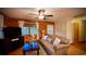 Comfortable living room with wood paneled walls, a plush sofa, and a flat screen TV at 2419 Hilton Dr., North Myrtle Beach, SC 29582