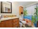 Bathroom with single vanity, framed mirror, and shower with fun, decorative shower curtain at 263 Walden Lake Rd., Conway, SC 29526