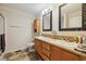 Bathroom featuring a double vanity with framed mirrors and a neutral color palette at 263 Walden Lake Rd., Conway, SC 29526