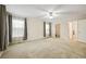Large main bedroom with carpet, ceiling fan and natural light leads to an ensuite and walk-in closet at 263 Walden Lake Rd., Conway, SC 29526