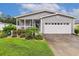 Charming home featuring a lovely front porch, well-maintained landscaping, and a two-car garage at 263 Walden Lake Rd., Conway, SC 29526