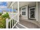 Inviting front porch with a seating area and a view of the surrounding landscape at 263 Walden Lake Rd., Conway, SC 29526