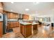 Open kitchen layout with an island, stainless appliances, and a view to the living area at 263 Walden Lake Rd., Conway, SC 29526
