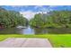 Beautiful lake view with a fountain surrounded by mature trees at 263 Walden Lake Rd., Conway, SC 29526