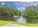 Picturesque lake with fountain, surrounded by lush green trees at 263 Walden Lake Rd., Conway, SC 29526