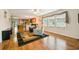 Bright, open-concept living room with wood floors, natural light, and easy flow into the kitchen area at 263 Walden Lake Rd., Conway, SC 29526