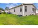 A view of the back of the house with vinyl siding and green grass at 263 Walden Lake Rd., Conway, SC 29526