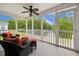 Relaxing screened-in porch with ceiling fan and serene lake view at 263 Walden Lake Rd., Conway, SC 29526