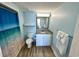 Comfortable bathroom featuring granite countertops, beach shower curtain, and ample storage at 3000 N Ocean Blvd. # 1406, Myrtle Beach, SC 29572