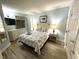 Comfortable bedroom with a nautical theme, soft lighting, and TV at 3000 N Ocean Blvd. # 1406, Myrtle Beach, SC 29572