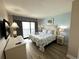 Relaxing bedroom featuring a queen bed, balcony access with ocean views, and coastal-themed decor at 3000 N Ocean Blvd. # 1406, Myrtle Beach, SC 29572