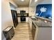 Modern kitchen equipped with stainless steel appliances and granite countertops at 3000 N Ocean Blvd. # 1406, Myrtle Beach, SC 29572