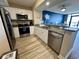 Well-equipped kitchen featuring stainless steel appliances and an open breakfast bar at 3000 N Ocean Blvd. # 1406, Myrtle Beach, SC 29572