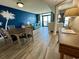 Inviting condo living area with beachy decor, sliding glass doors, and balcony access at 3000 N Ocean Blvd. # 1406, Myrtle Beach, SC 29572