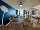 Bright living area features a balcony with ocean view, beach decor, and dining area at 3000 N Ocean Blvd. # 1406, Myrtle Beach, SC 29572