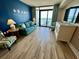 Cozy living space featuring comfortable seating and a view of the ocean through sliding glass doors at 3000 N Ocean Blvd. # 1406, Myrtle Beach, SC 29572