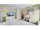 Bedroom offers a dresser with TV, queen-sized bed and connects to kitchen at 3000 N Ocean Blvd. # 333, Myrtle Beach, SC 29577